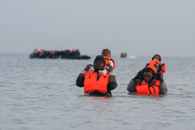 May 23, 2026, Dunkirk, Nord, France: Dunkirk, France. A family of migrants in the sea after failing to board an inflatable boat at the beach at Dunkirk, while attempting to cross the English Channel. More than 200,000 migrants have crossed the Channel in small boats since 2018. Dunkirk France  - ZUMAl94_ 20260523_zaf_l94_036 Copyright: xIoannisxAlexopoulosx