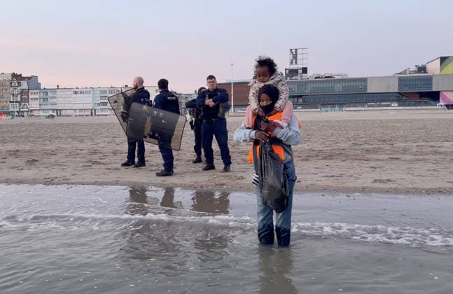 May 23, 2026, Dunkirk, Nord, France: Dunkirk, France. Police watch on as migrants wait to board an inflatable boat at the beach at Dunkirk, while attempting to cross the English Channel. More than 200,000 migrants have crossed the Channel in small boats since 2018. Dunkirk France  - ZUMAl94_ 20260523_zaf_l94_056 Copyright: xIoannisxAlexopoulosx