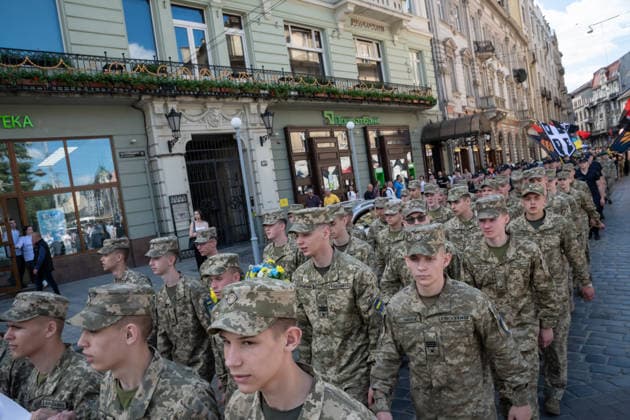 Commemoration procession held on Heroes Day in Lviv, Ukraine LVIV, UKRAINE - MAY 23: Service members and civilians take part in a procession dedicated to the participants of the ATO JFO, veterans, and individuals who lost their lives or are involved in the conflict in Ukraine, during Heroes Day in Lviv, Ukraine on May 23, 2026. Participants marched through the city and held a commemoration for the fallen service members at the burial grounds within the Lychakiv Cemetery. Olena Znak Anadolu Lviv Ukraine. Editorial use only. Please get in touch for any other usage.  Copyright: x2026xAnadoluxOlenaxZnakx