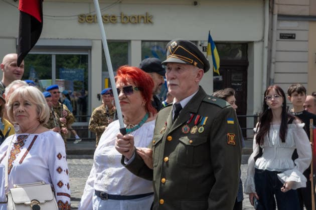 Commemoration procession held on Heroes Day in Lviv, Ukraine LVIV, UKRAINE - MAY 23: Service members and civilians take part in a procession dedicated to the participants of the ATO JFO, veterans, and individuals who lost their lives or are involved in the conflict in Ukraine, during Heroes Day in Lviv, Ukraine on May 23, 2026. Participants marched through the city and held a commemoration for the fallen service members at the burial grounds within the Lychakiv Cemetery. Olena Znak Anadolu Lviv Ukraine. Editorial use only. Please get in touch for any other usage.  Copyright: x2026xAnadoluxOlenaxZnakx