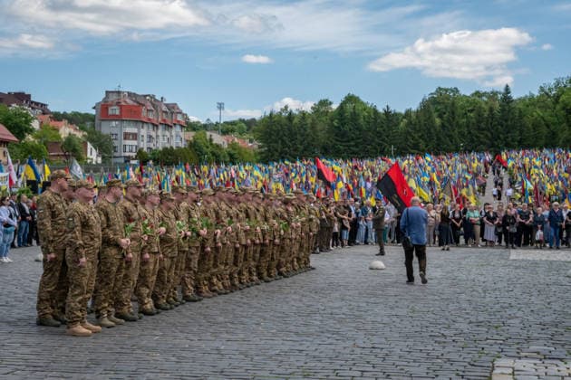 Commemoration procession held on Heroes Day in Lviv, Ukraine LVIV, UKRAINE, MAY 23: Military and civilians take part in a ceremony to honor the memory of fallen servicemen at the honorary burial grounds at the Lychakiv Cemetery during the Day of Heroes of Ukraine in Lviv, Ukraine, May 23, 2026. Also on this day, military personnel, police, members of youth organizations and civilians marched through the city in a solemn procession dedicated to all participants of the ATO JFO, war veterans and participants who died or are fighting for the freedom of Ukraine. Olena Znak Anadolu Lviv Ukraine. Editorial use only. Please get in touch for any other usage.  Copyright: x2026xAnadoluxOlenaxZnakx
