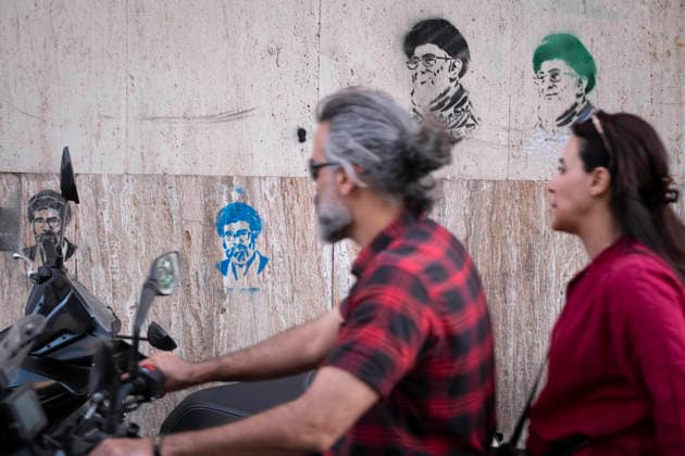 Daily Life In Iran Amid Threat About New Possible War Iranians ride a motorcycle past graffiti depicting portraits of Iran s late and new Supreme Leaders Ayatollah Ali Khamenei and Ayatollah Mojtaba Khamenei in a business district in downtown Tehran, Iran, on May 22, 2026. U.S. President Donald Trump has threatened Iran with the possibility of a new conflict, and according to official reports, he is considering military action if no agreement is reached with Iranian officials. Tehran Tehran Iran  Copyright: xMortezaxNikoubazlx originalFilename: nikoubazl-dailylif260522_npZI1.jpg