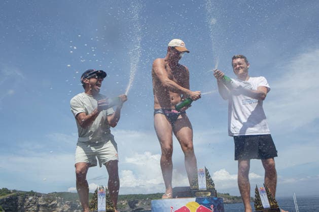 May 23, 2026, Klungkung, Bali, Indonesia: Aidan Heslop (Middle) 1 st, Jonathan Parades (Left) 2st and James Lichtenstein (Right) 3st of celebrates on the podium after winning the Red Bull Cliff Diving World Series at Broken Beach in Nusa Penida, Bali, Indonesia. Klungkung Indonesia - ZUMAp229 20260523_zip_p229_013 Copyright: xLanaxPriatnax