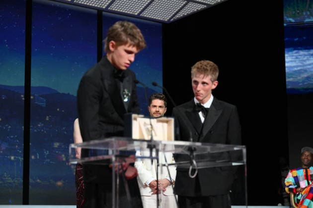 Cannes - Closing Ceremony Lukas Dhont looks at Belgian actor Emmanuel Macchia and French actor Valentin Campagne celebrating on stage after winning ex-aequo the Best Actor Prize for the film Coward on stage during the closing ceremony of the 79th edition of the Cannes Film Festival in Cannes, France on May 23, 2026. Photo by Eliot Blondet ABACAPRESS.COM Cannes France  Copyright: xBlondetxEliot ABACAx