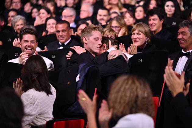 Cannes - Closing Ceremony (L) Lukas Dhont celebrates with Belgian actor Emmanuel Macchia and French actor Valentin Campagne after they together won ex-aequo the Best Actor Prize for the film Coward on stage during the closing ceremony of the 79th edition of the Cannes Film Festival in Cannes, France on May 23, 2026. Photo by Eliot Blondet ABACAPRESS.COM Cannes France  Copyright: xBlondetxEliot ABACAx
