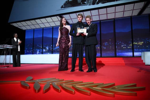 Cannes - Closing Ceremony Eye Haidara, Geena Davis, Belgian actor Emmanuel Macchia and French actor Valentin Campagne celebrate on stage after winning ex-aequo the Best Actor Prize for the film Coward on stage during the closing ceremony of the 79th edition of the Cannes Film Festival in Cannes, France on May 23, 2026. Photo by Eliot Blondet ABACAPRESS.COM Cannes France  Copyright: xBlondetxEliot ABACAx