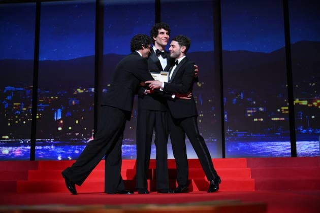 Cannes - Closing Ceremony Canadian filmmaker Xavier Dolan, Spanish director, screenwriter and producer Javier Ambrossi and Spanish director, screenwriter and producer Javier Calvo celebrate after winning the Best Director Prize for the film La Bola Negra during the closing ceremony of the 79th edition of the Cannes Film Festival in Cannes, France on May 23, 2026. Photo by Eliot Blondet ABACAPRESS.COM Cannes France  Copyright: xBlondetxEliot ABACAx