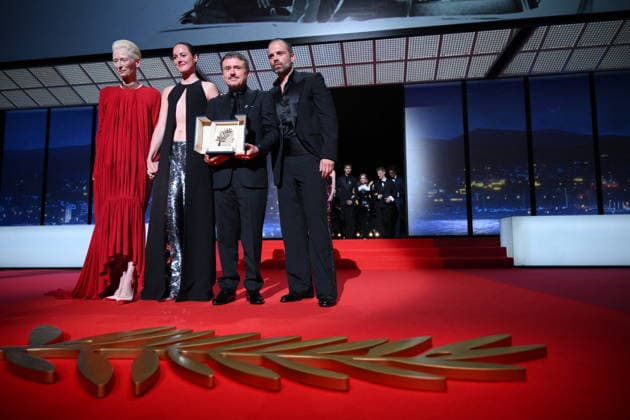 Cannes - Fjord Wins Palme D Or Award At Closing Ceremony (L-R) British actress, Tilda Swinton, Norwegian actress, Renate Reinsve, Romanian director, screenwriter and producer Cristian Mungiu and Romanian-born American actor Sebastian Stan celebrate on stage after winning the Palme d Or for the film Fjord during the closing ceremony of the 79th edition of the Cannes Film Festival in Cannes, France on May 23, 2026. Photo by Eliot Blondet ABACAPRESS.COM Cannes France  Copyright: xBlondetxEliot ABACAx