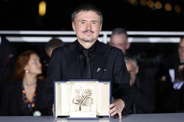 Cannes - Fjord Wins Palme D Or Award At Closing Ceremony Romanian director, screenwriter and producer Cristian Mungiu celebrate after winning the Palme d Or for the film Fjord during the photocall of the 79th edition of the Cannes Film Festival in Cannes, France on May 23, 2026. Photo by Jerome Domine ABACAPRESS.COM Cannes France  Copyright: xDominexJerome ABACAx