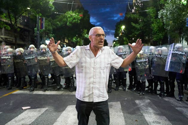 May 23, 2026, Belgrade, Central Serbia, Serbia: 2026523, Belgrade, Serbia - A large number of citizens answer the call of university students and gather to protest in the center of Belgrade. A man gestures, calling on demonstrators to refrain from violence, while standing in front of riot police. Belgrade Serbia  - ZUMAd223 20260523_zip_d223_016 Copyright: xMarkoxDimicx