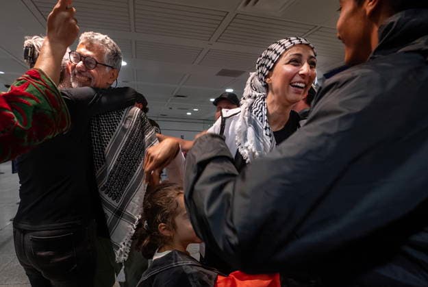 May 23, 2026, Montreal, Pq, CANADA: Ehab Lotayef, left, and Safa Chebbi, right, are greeted as they arrive back at Montreal s Trudeau International Airport on Saturday, May 23, 2026. Chebbi and Lotayef were two of the 12 Canadians who were on board a flotilla trying to reach Gaza and spent four days in Israeli captivity. Montreal CANADA  - ZUMAc35_ 20260523_zaf_c35_154 Copyright: xPeterxMccabex
