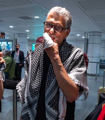 May 23, 2026, Montreal, Pq, CANADA: Ehab Lotayef reacts with a bandaged hand as he is greeted at Montreal s Trudeau International Airport on Saturday, May 23, 2026. Lotayef was one of the 12 Canadians who were on board a flotilla trying to reach Gaza and spent four days in Israeli captivity. Montreal CANADA  - ZUMAc35_ 20260523_zaf_c35_155 Copyright: xPeterxMccabex