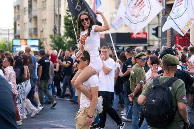 May 23, 2026, Belgrade, Central Serbia, Serbia: 2026523, Belgrade, Serbia - A large number of citizens answer the call of university students and gather to protest in the center of Belgrade. A female demonstrator sits on a man s shoulders during the protest. Belgrade Serbia - ZUMAd223 20260523_zip_d223_004 Copyright: xMarkoxDimicx