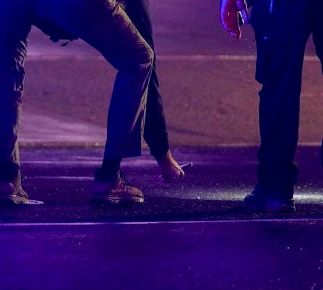 May 23, 2026, Washington, District Of Columbia, USA: Police investigators collect evidence in the 1700 block of Pennsylvania Avenue, Northwest, which is one block west of the White House in Washington, DC, USA, following the shooting there on Saturday, May 23, 2026. Two people were shot and taken to a local hospital, one has died Washington USA - ZUMAs152 20260523_faa_s152_039 Copyright: xAndrewxThomasx