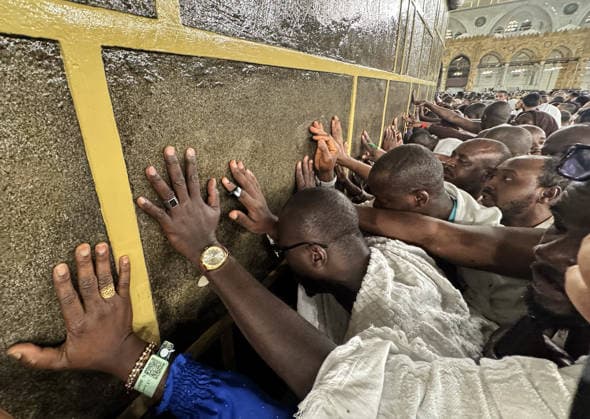 Muslims perform the Hajj pilgrimage MECCA, SAUDI ARABIA - MAY 23: Pilgrims pray while touching the walls of the Kaaba during the Hajj pilgrimage before Eid al-Adha in Mecca, Saudi Arabia on May 23, 2026. Ali Atmaca Anadolu Mecca Saudi Arabia. Editorial use only. Please get in touch for any other usage.  Copyright: x2026xAnadoluxAlixAtmacax