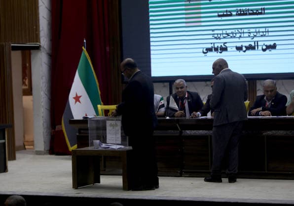 Syria holds parliamentary elections in Ain al-Arab ALEPPO GOVERNORATE, SYRIA - MAY 24: Voting begin to elect members of the country’s People’s Assembly (parliament), the Higher Committee for People’s Assembly Elections said in Ayn al-Arab district of Aleppo Governorate in northern Syria, on May 24, 2026. Polling opened in the Hasakah and Qamishli districts of Hasakah province, as well as in the Ain al-Arab district of Aleppo province, the SANA news agency said, citing the committee. The committee stated that 12 candidates are contesting two seats in Ain al-Arab from an electoral body of 100 members, while 13 candidates are competing for three seats in Hasakah, where 150 electors are eligible to vote. Bakr Al Kasem Anadolu Aleppo Syria. Ed  Copyright: x2026xAnadoluxBakrxAlxKasemx