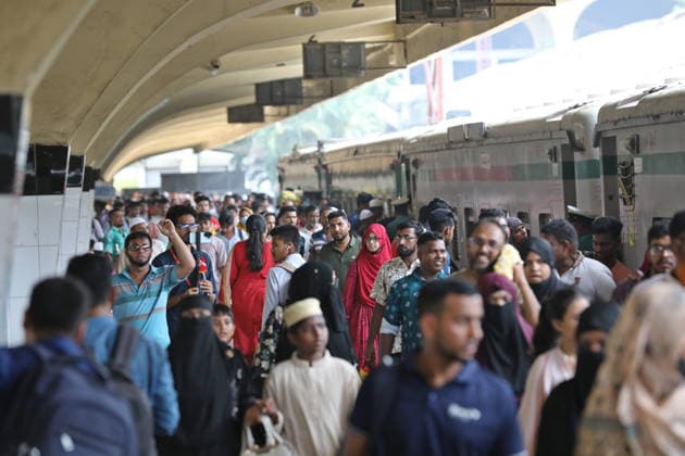 (260524) -- DHAKA, May 24, 2026 -- People are pictured during the Eid al-Adha travel rush at Kamalapur Railway Station in Dhaka, Bangladesh, May 24, 2026. As Eid al-Adha approaches, many people from Dhaka have streamed out of the city to join the festival with their kith and kin in hometowns. (Photo by Xinhua) BANGLADESH-DHAKA-AHEAD-EID AL-ADHA-TRAVEL RUSH HabiburxRahman 