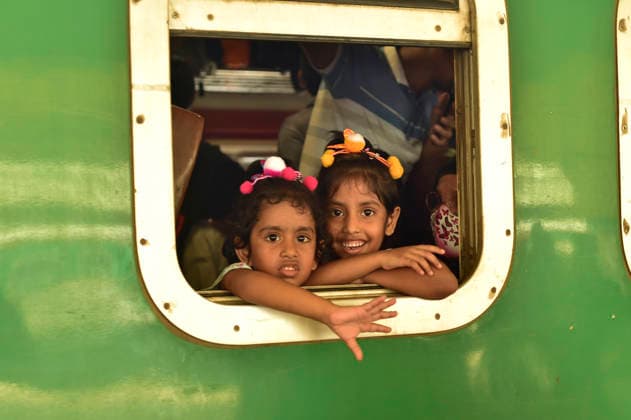 (260524) -- DHAKA, May 24, 2026 -- Children are pictured aboard a train during the Eid al-Adha travel rush at Kamalapur Railway Station in Dhaka, Bangladesh, May 24, 2026. As Eid al-Adha approaches, many people from Dhaka have streamed out of the city to join the festival with their kith and kin in hometowns. (Photo by Xinhua) BANGLADESH-DHAKA-AHEAD-EID AL-ADHA-TRAVEL RUSH HabiburxRahman 