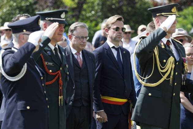 Prime Minister Bart De Wever (3L) and Kristof Chanterie pictured during the annual Memorial Day ceremony at the Flanders Field American Cemetery, in Waregem, Sunday 24 May 2026.  NICOLASxMAETERLINCK 174928987