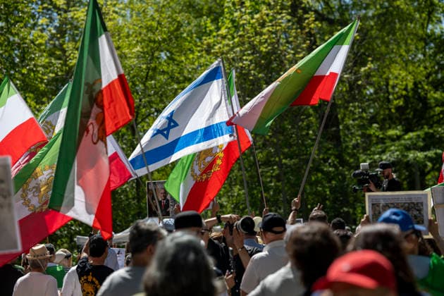 May 24, 2026, Stockholm, Sweden: Anti-Iranian regime protesters gather outside the Iranian Embassy in Stockholm, Sweden, on May 24, 2026, calling on Sweden to close the embassy and demanding restored internet access in Iran. Some demonstrators carried flags and signs in support of Reza Pahlavi. During the protest, participants staged a symbolic performance depicting imprisoned women confronting captured clerics, while chanting slogans against the Iranian regime and the ruling mullahs. Sweden - ZUMAa136 20260524_zap_a136_004 Copyright: xJoelxLindhex