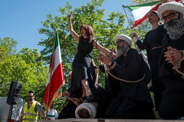 May 24, 2026, Stockholm, Sweden: Anti-Iranian regime protesters gather outside the Iranian Embassy in Stockholm, Sweden, on May 24, 2026, calling on Sweden to close the embassy and demanding restored internet access in Iran. Some demonstrators carried flags and signs in support of Reza Pahlavi. During the protest, participants staged a symbolic performance depicting imprisoned women confronting captured clerics, while chanting slogans against the Iranian regime and the ruling mullahs. Sweden - ZUMAa136 20260524_zap_a136_009 Copyright: xJoelxLindhex