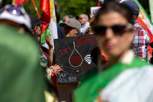 May 24, 2026, Stockholm, Sweden: Anti-Iranian regime protesters gather outside the Iranian Embassy in Stockholm, Sweden, on May 24, 2026, calling on Sweden to close the embassy and demanding restored internet access in Iran. Some demonstrators carried flags and signs in support of Reza Pahlavi. During the protest, participants staged a symbolic performance depicting imprisoned women confronting captured clerics, while chanting slogans against the Iranian regime and the ruling mullahs. Sweden  - ZUMAa136 20260524_zap_a136_017 Copyright: xJoelxLindhex