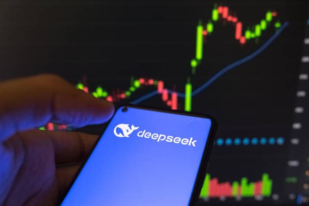 DeepSeek The DeepSeek logo appears on a smartphone screen, with a stock exchange curve chart displayed as the background on a laptop computer screen in this photo illustration in Athens, Greece, on May 24, 2026. Athens Greece  Copyright: xNikolasxKokovlisx originalFilename: kokovlis-notitle260524_np0Wr.jpg