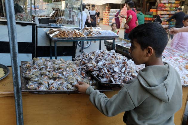 Palestinian workers produce traditional sweets ahead of Eid al-Adha Palestinian workers continued producing the traditional sweet known locally as Halakum at a factory in the Al-Daraj neighborhood, east of Gaza City, on May 24, 2026, ahead of Eid al-Adha. The factory resumed operations with limited resources after sustaining damage from Israeli airstrikes during the war. Halakum is a traditional sweet widely consumed during holidays, and the factory strives to provide it to residents despite the difficult living conditions and sharp decline in purchasing power in the Gaza Strip before Eid al-Adha. Photo by Bilal Osama apaimages Gaza city Gaza Strip Palestinian Territory 240526_Gaza_BO_01(55) Copyright: xapaimagesxBilalxOsamax xapaimagesx