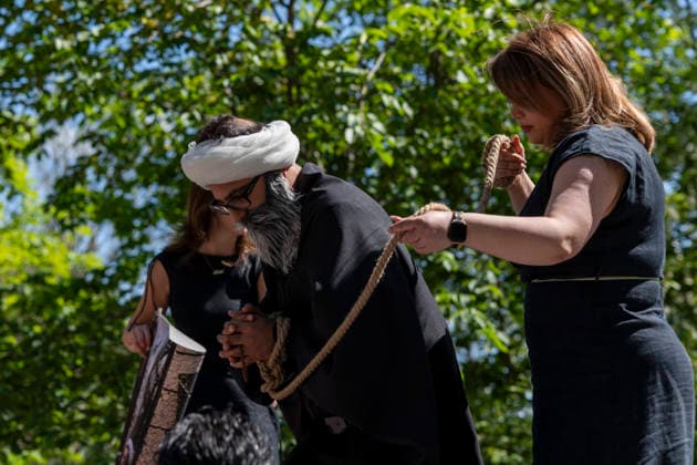 May 24, 2026, Stockholm, Sweden: Anti-Iranian regime protesters gather outside the Iranian Embassy in Stockholm, Sweden, on May 24, 2026, calling on Sweden to close the embassy and demanding restored internet access in Iran. Some demonstrators carried flags and signs in support of Reza Pahlavi. During the protest, participants staged a symbolic performance depicting imprisoned women confronting captured clerics, while chanting slogans against the Iranian regime and the ruling mullahs. Sweden  - ZUMAa136 20260524_zap_a136_027 Copyright: xJoelxLindhex
