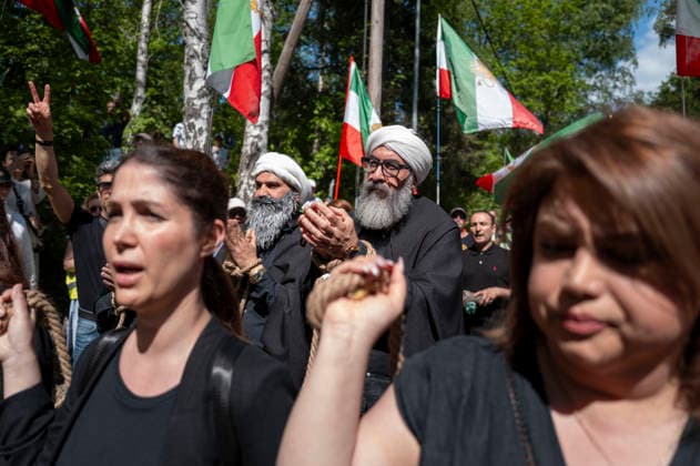 May 24, 2026, Stockholm, Sweden: Anti-Iranian regime protesters gather outside the Iranian Embassy in Stockholm, Sweden, on May 24, 2026, calling on Sweden to close the embassy and demanding restored internet access in Iran. Some demonstrators carried flags and signs in support of Reza Pahlavi. During the protest, participants staged a symbolic performance depicting imprisoned women confronting captured clerics, while chanting slogans against the Iranian regime and the ruling mullahs. Sweden  - ZUMAa136 20260524_zap_a136_028 Copyright: xJoelxLindhex