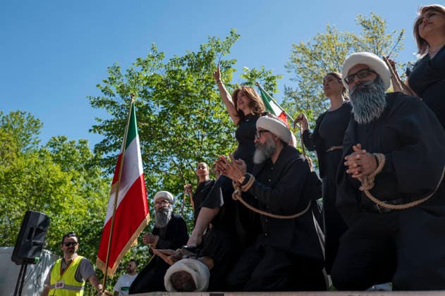 May 24, 2026, Stockholm, Sweden: Anti-Iranian regime protesters gather outside the Iranian Embassy in Stockholm, Sweden, on May 24, 2026, calling on Sweden to close the embassy and demanding restored internet access in Iran. Some demonstrators carried flags and signs in support of Reza Pahlavi. During the protest, participants staged a symbolic performance depicting imprisoned women confronting captured clerics, while chanting slogans against the Iranian regime and the ruling mullahs. Sweden  - ZUMAa136 20260524_zap_a136_019 Copyright: xJoelxLindhex