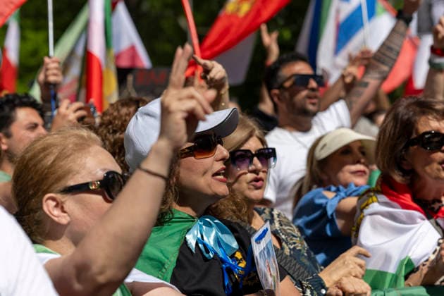 May 24, 2026, Stockholm, Sweden: Anti-Iranian regime protesters gather outside the Iranian Embassy in Stockholm, Sweden, on May 24, 2026, calling on Sweden to close the embassy and demanding restored internet access in Iran. Some demonstrators carried flags and signs in support of Reza Pahlavi. During the protest, participants staged a symbolic performance depicting imprisoned women confronting captured clerics, while chanting slogans against the Iranian regime and the ruling mullahs. Sweden  - ZUMAa136 20260524_zap_a136_024 Copyright: xJoelxLindhex
