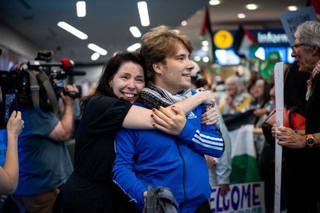 May 24, 2026, Vancouver, Bc, CANADA: Sebastian Tow, right, member of the Gaza flotilla, reunites with his mother Anita Wittenberg as he arrives at the Vancouver International Airport in Richmond B.C., on Sunday, May 24, 2026. Vancouver CANADA  - ZUMAc35_ 20260524_zaf_c35_148 Copyright: xEthanxCairnsx