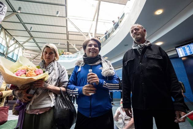 May 24, 2026, Vancouver, Bc, CANADA: Mary Grace Mathisen, left to right, Sebastian Tow, and Michael France, members of the Gaza bound flotilla which was detained by Israel, arrive at the Vancouver International Airport in Richmond B.C., on Sunday, May 24, 2026. Vancouver CANADA  - ZUMAc35_ 20260524_zaf_c35_158 Copyright: xEthanxCairnsx