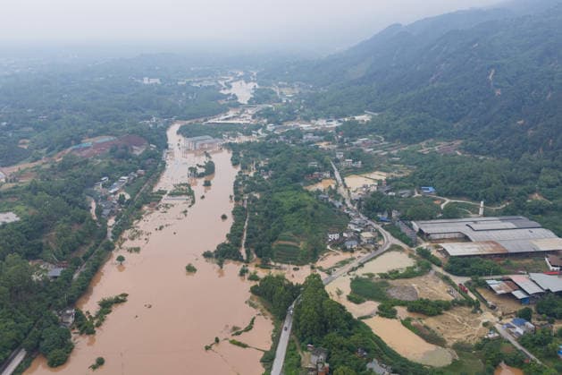 CHONGQING, CHINA - MAY 24: Aerial view of flooded Anxi Village after extreme rainfalls trigger flash floods and geological disasters on May 24, 2026 in Yongchuan District, Chongqing City, China. Devastating rainstorms struck parts of Southwest China s Chongqing over the weekend, resulting in multiple casualties and missing people in the municipality s Yongchuan and Beibei districts. Rescue efforts are ongoing. As of 2:30 pm on May 24, local authorities reported three deaths and 17 people missing in Yongchuan, with another two people missing in Beibei.  Copyright: xChinaxNewsxServicex 111643812906