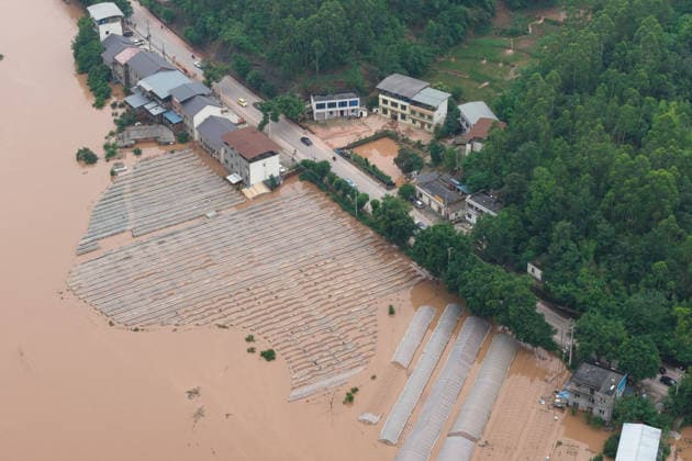 CHONGQING, CHINA - MAY 24: Rows of greenhouses are submerged after extreme rainfalls trigger flash floods and geological disasters on May 24, 2026 in Yongchuan District, Chongqing City, China. Devastating rainstorms struck parts of Southwest China s Chongqing over the weekend, resulting in multiple casualties and missing people in the municipality s Yongchuan and Beibei districts. Rescue efforts are ongoing. As of 2:30 pm on May 24, local authorities reported three deaths and 17 people missing in Yongchuan, with another two people missing in Beibei.  Copyright: xChinaxNewsxServicex 111643812950
