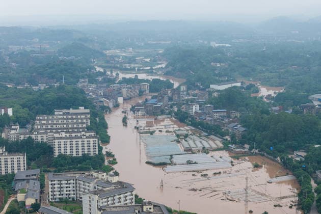 CHONGQING, CHINA - MAY 24: Rows of greenhouses are submerged after extreme rainfalls trigger flash floods and geological disasters on May 24, 2026 in Yongchuan District, Chongqing City, China. Devastating rainstorms struck parts of Southwest China s Chongqing over the weekend, resulting in multiple casualties and missing people in the municipality s Yongchuan and Beibei districts. Rescue efforts are ongoing. As of 2:30 pm on May 24, local authorities reported three deaths and 17 people missing in Yongchuan, with another two people missing in Beibei.  Copyright: xChinaxNewsxServicex 111643812993