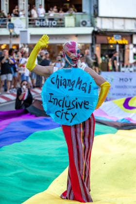 May 24, 2026, Chiang Mai, Thailand: Sirisak Chaited, representative of the Chiang Mai Pride organizing committee, poses on a large rainbow flag during the Chiang Mai Pride Parade. The Chiang Mai Pride Parade 2026 took place in Chiang Mai, Thailand. Chiang Mai province holds Thailandis first Pride Month celebrations annually, promoting gender equality, diversity, and human rights as part of Pride Month activities in northern Thailand. Chiang Mai Thailand - ZUMAs197 20260524_aaa_s197_114 Copyright: xPongmanatxTasirix