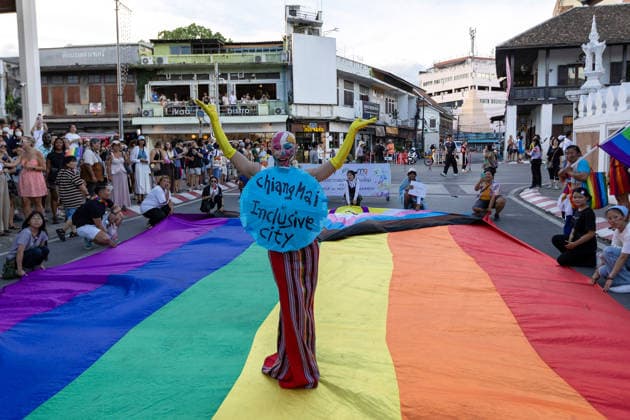 May 24, 2026, Chiang Mai, Thailand: Sirisak Chaited, representative of the Chiang Mai Pride organizing committee, poses on a large rainbow flag during the Chiang Mai Pride Parade. The Chiang Mai Pride Parade 2026 took place in Chiang Mai, Thailand. Chiang Mai province holds Thailandis first Pride Month celebrations annually, promoting gender equality, diversity, and human rights as part of Pride Month activities in northern Thailand. Chiang Mai Thailand - ZUMAs197 20260524_aaa_s197_147 Copyright: xPongmanatxTasirix