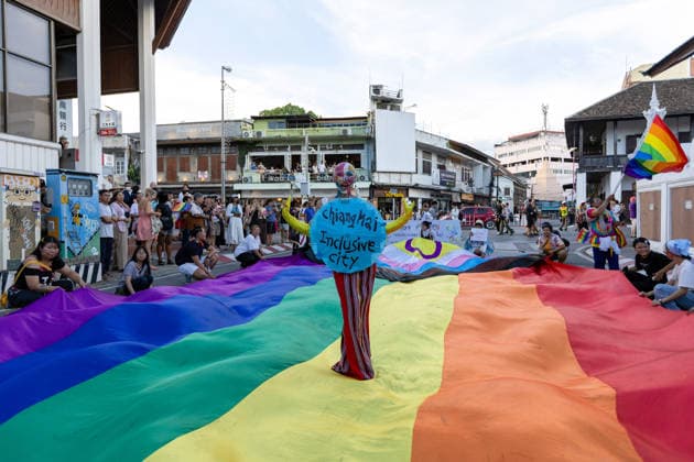 May 24, 2026, Chiang Mai, Thailand: Sirisak Chaited, representative of the Chiang Mai Pride organizing committee, poses on a large rainbow flag during the Chiang Mai Pride Parade. The Chiang Mai Pride Parade 2026 took place in Chiang Mai, Thailand. Chiang Mai province holds Thailandis first Pride Month celebrations annually, promoting gender equality, diversity, and human rights as part of Pride Month activities in northern Thailand. Chiang Mai Thailand - ZUMAs197 20260524_aaa_s197_149 Copyright: xPongmanatxTasirix