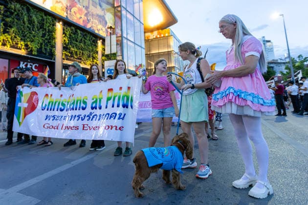 May 24, 2026, Chiang Mai, Thailand: A participant wearing a pink dress stands beside a Ã¬Christians at Pridei banner during The Chiang Mai Pride Parade 2026 celebrations. The Chiang Mai Pride Parade 2026 took place in Chiang Mai, Thailand. Chiang Mai province holds Thailandis first Pride Month celebrations annually, promoting gender equality, diversity, and human rights as part of Pride Month activities in northern Thailand. Chiang Mai Thailand - ZUMAs197 20260524_aaa_s197_152 Copyright: xPongmanatxTasirix