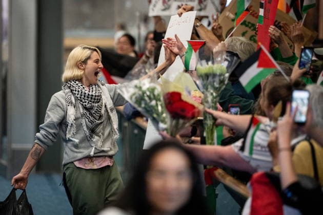 May 24, 2026, Vancouver, Bc, CANADA: Mary Grace Mathisen, member of the Gaza flotilla runs to friends and family as she arrives at the Vancouver International Airport in Richmond B.C., on Sunday, May 24, 2026. Vancouver CANADA  - ZUMAc35_ 20260524_zaf_c35_186 Copyright: xEthanxCairnsx