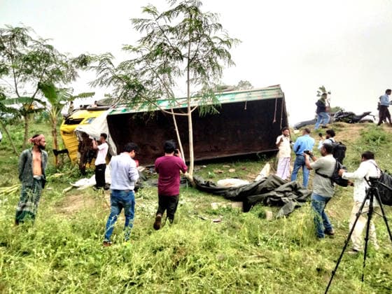 (260525) -- TANGAIL, May 25, 2026 () -- People gather at the site of a truck accident in Tangail district, Bangladesh, May 25, 2026. At least 15 people were killed, and six others injured early on Monday when a rod-laden truck overturned into a bridge-side ditch in Bangladesh s Tangail district, some 97 km away from the capital Dhaka. () (SpotNews) BANGLADESH-TANGAIL-TRUCK-ACCIDENT Xinhua 