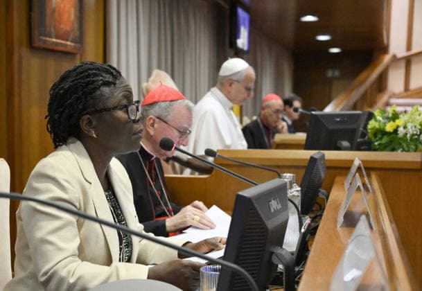 Pope Leo XIV Presents His First Encyclical On Artificial Intelligence - Vatican Pope Leo XIV, Cardinal Secretary of State Pietro Parolin (C) and Léocadie Wabo Lushombo (Left) (prominent Congolese theologian) attend the presentation of Pope Leo’s first Encyclical titled ‘Magnifica humanitas’ (Magnificent Humanity), in the Vatican on May 25, 2026, a call to remain human in the age of Artificial Intelligence (AI). Pope Leon XIV appealed for the safeguarding of humanity, promotion of truth, dignity of work, social justice, and peace. Photo by (EV) Simone Risoluti Vatican Media ABACAPRESS.COM Vatican City Rome Vatican (or Holy See)  Copyright: xABACAx