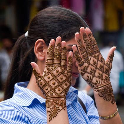 A woman shows her hands adorned with henna ahead of the Eid al-Adha festival Srinagar, May 25 (ANI): A woman shows her hands adorned with henna ahead of the Eid al-Adha festival, in Srinagar on Monday. Srinagar Jammu and Kashmir India Copyright: xANIx ANI_20260525265