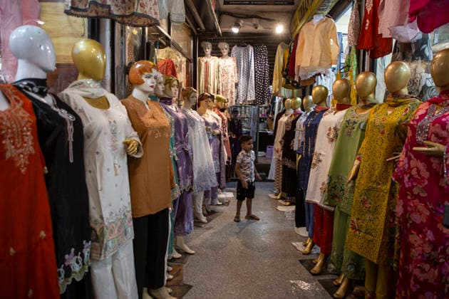May 25, 2026, Srinagar, Jammu And Kashmir, India: A child is seen playing in a market full of mannequins as people shop ahead of Eid al-Adha, also known as the Festival of Sacrifice, in Srinagar. Eid al-Adha is the second major Islamic festival of the year. Eid ul-Adha ( Festival of Sacrifice ) is one of the most important festivals in the Muslim calendar. The festival commemorates Prophet Ibrahim s willingness to sacrifice his son in obedience to God s command. Srinagar India - ZUMAa205 20260525_zip_a205_021 Copyright: xAdilxAbassx