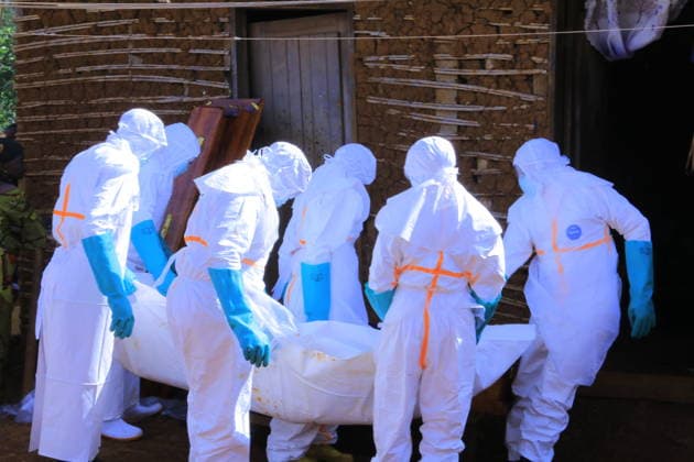 Ebola outbreak in Democratic Republic of Congo MONGBWALU, DEMOCRATIC REPUBLIC OF THE CONGO - MAY 25: Health workers wearing protective equipment carry the body of a person who died with suspected Ebola infection in Mongbwalu village of Ituri province in eastern Democratic Republic of the Congo, on May 25, 2026. Marcus Loika Anadolu Mongbwalu Democratic Republic of the Congo. Editorial use only. Please get in touch for any other usage.  Copyright: x2026xAnadoluxMarcusxLoikax
