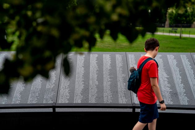 A boy reads names at the Korean War Memorial on Memorial Day in Washington, DC on Monday, May 25, 2026.  WAP20260525339 BONNIExCASH