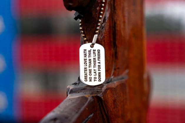 An art instillation from Veterans and Athletes United featuring a dog tag hanging from combat boots is seen outside the Lincoln Memorial on Memorial Day in Washington, DC on Monday, May 25, 2026.  WAP20260525301 BONNIExCASH