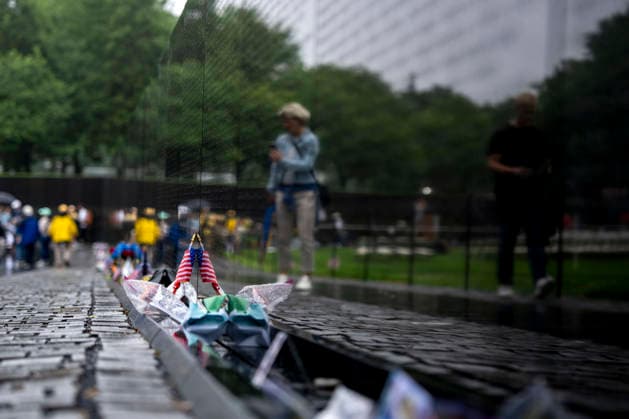 Flags, notes, and mementos are left at the Vietnam Veterans Memorial on Memorial Day in Washington, DC on Monday, May 25, 2026.  WAP20260525311 BONNIExCASH